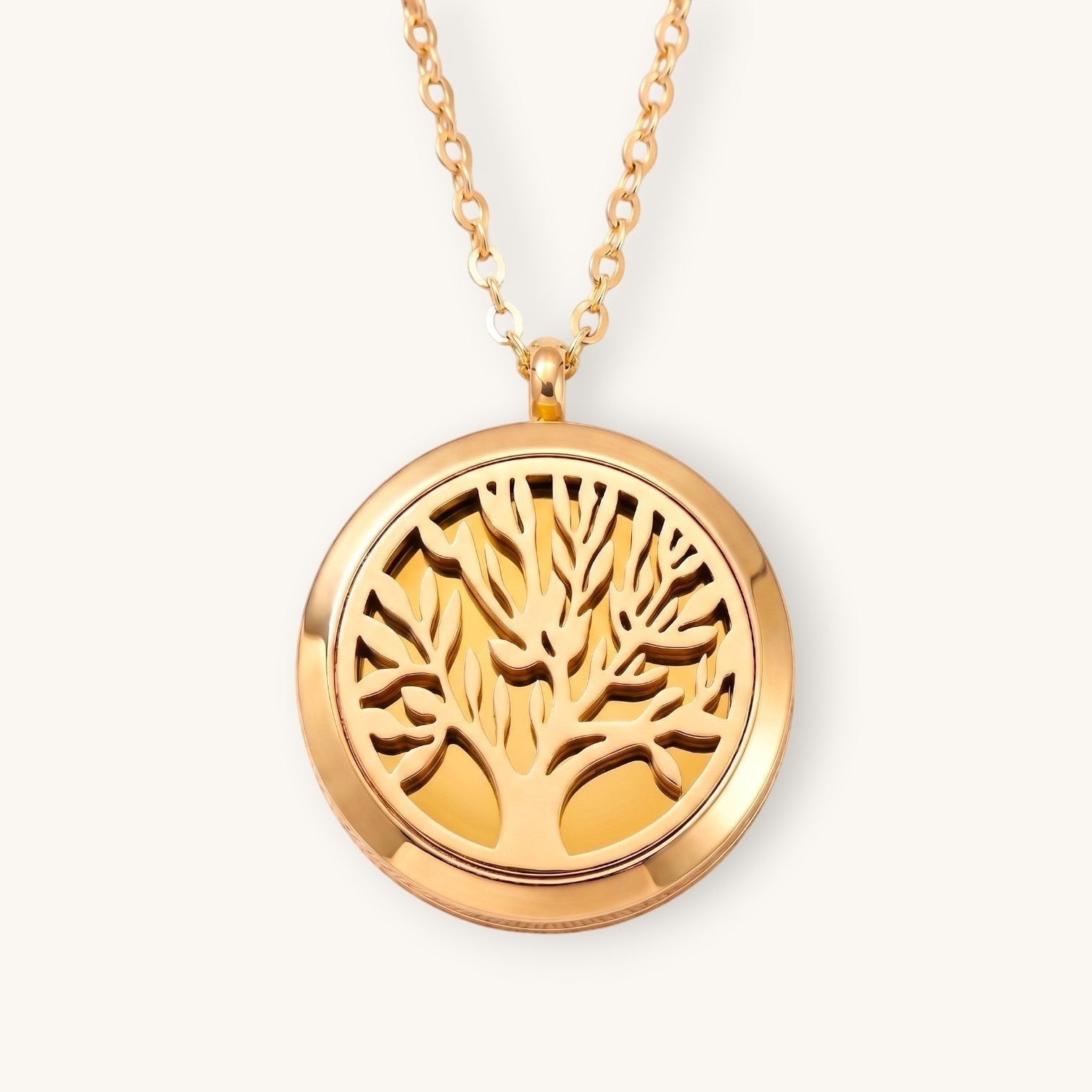 Collar Moment de acero inoxidable color oro rosa con medallón redondo y diseño calado de árbol de la vida
