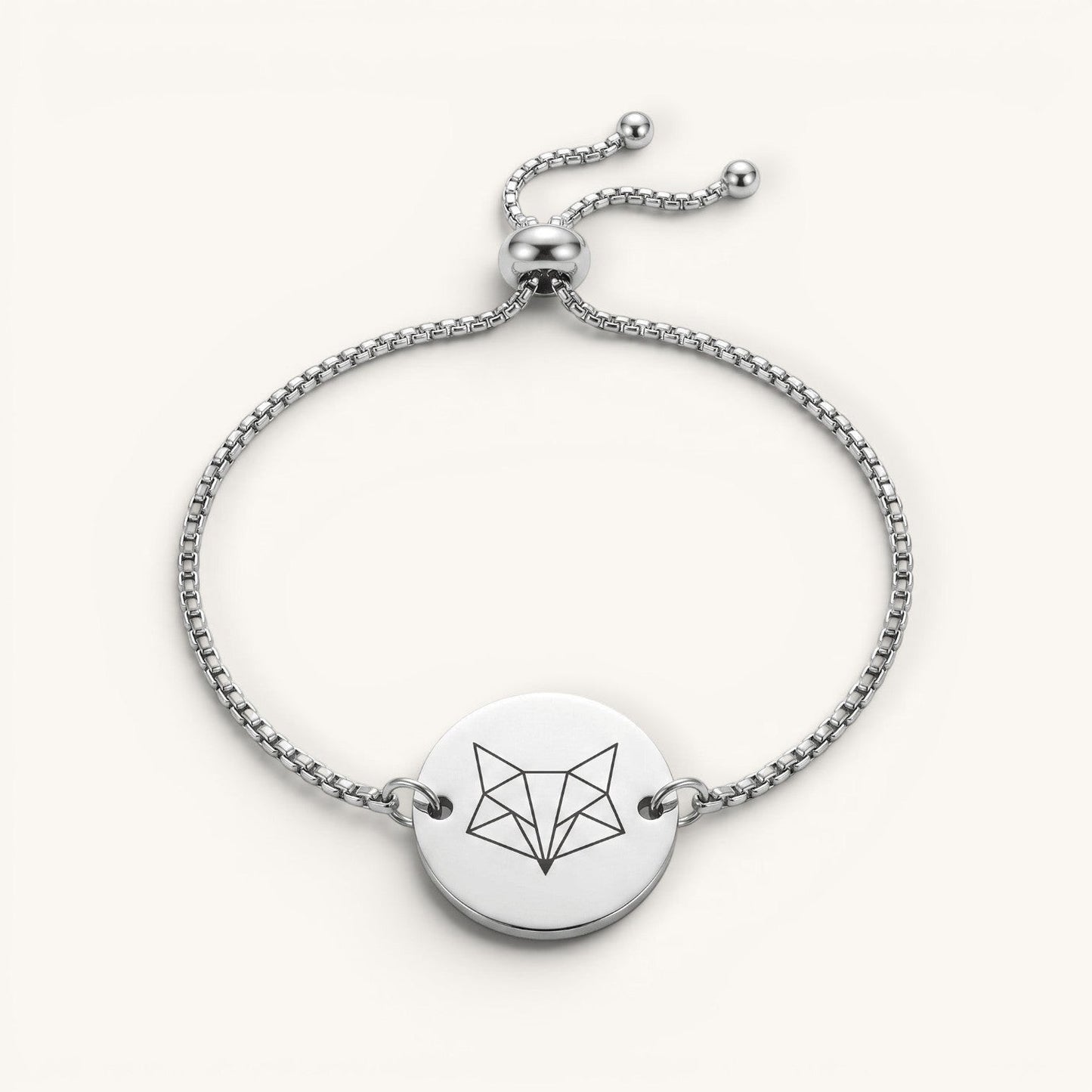 Pulsera Aura Moment de acero inoxidable ajustable con medalla redonda grabada con diseño geométrico de zorro